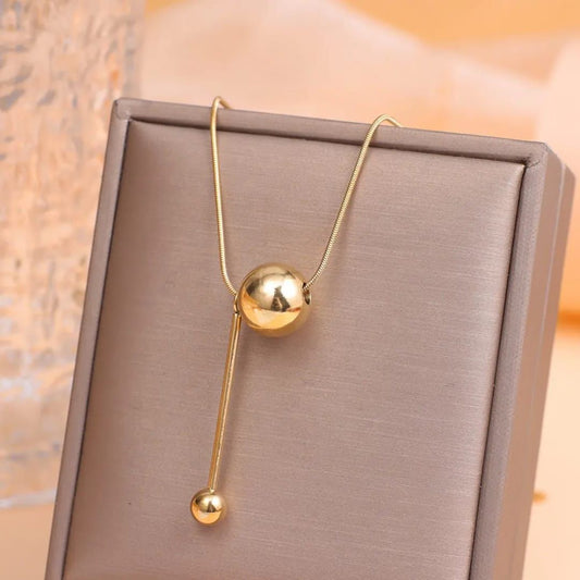 Modern Gold Orb Pendant Necklace – Minimalist Statement Jewelry
